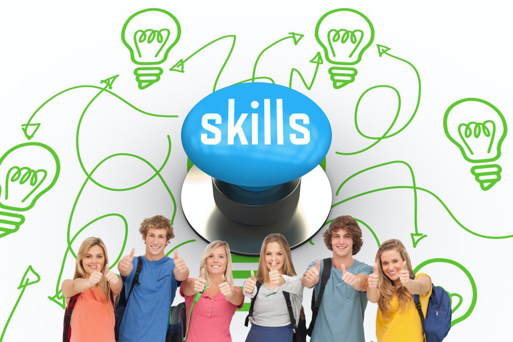 The word skills and smiling group giving a thumbs up as they wear backpacks against blue push button